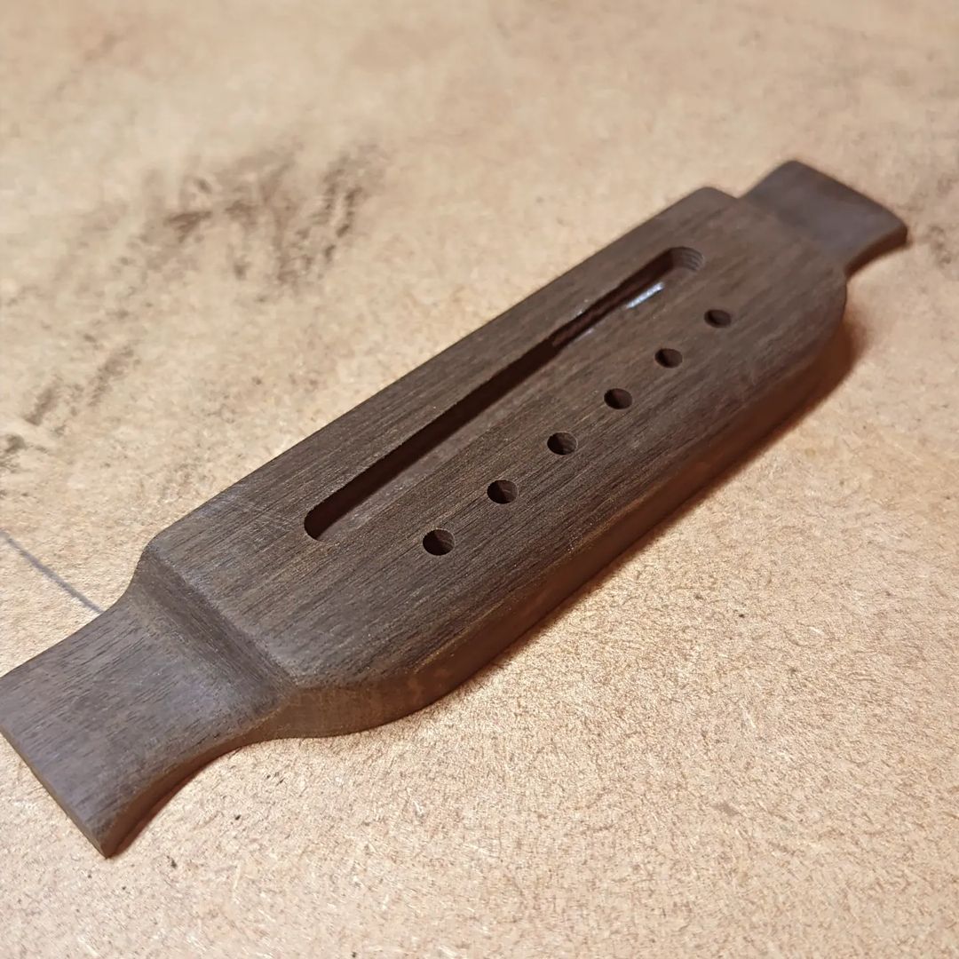 Coming nicely...!!! #Ebony #guitarbridge #xylonguitars #lutherie #acousticguitar #omguitar #customguitars #woodworking #guita...